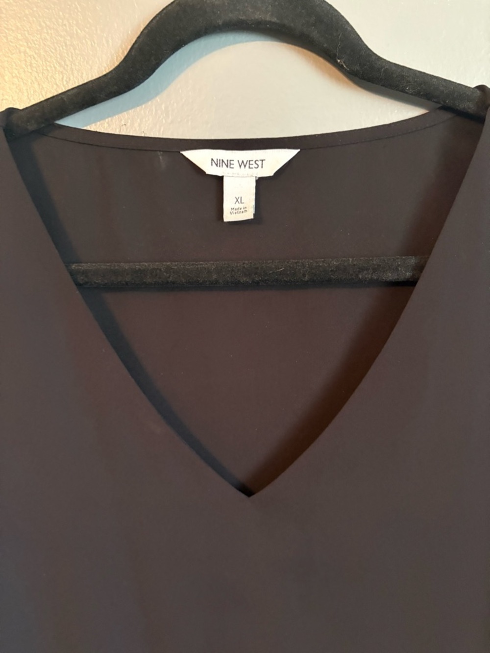2 Tops for $17.00.  Black V-Neck Top and Ruffled Neck Top. Like new